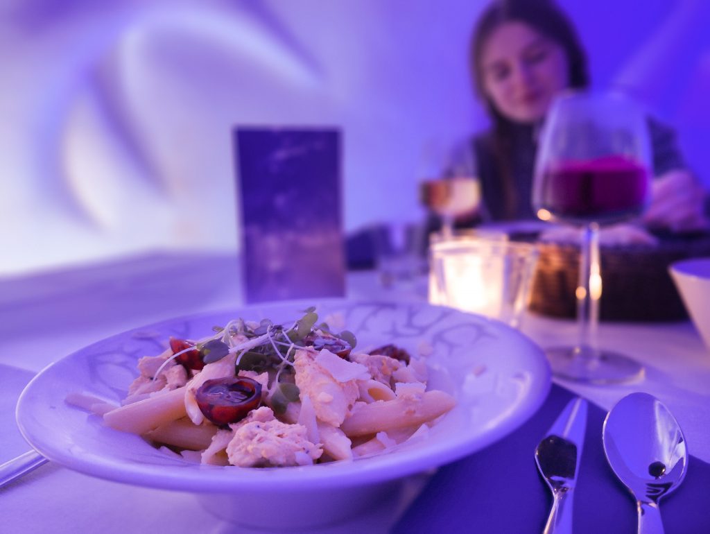 A woman enjoying lunch in the Snow Restaurant