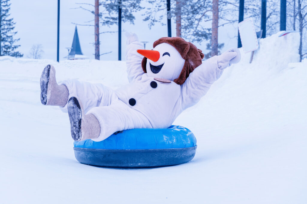 Hanki in a snow tube in the Snowman World