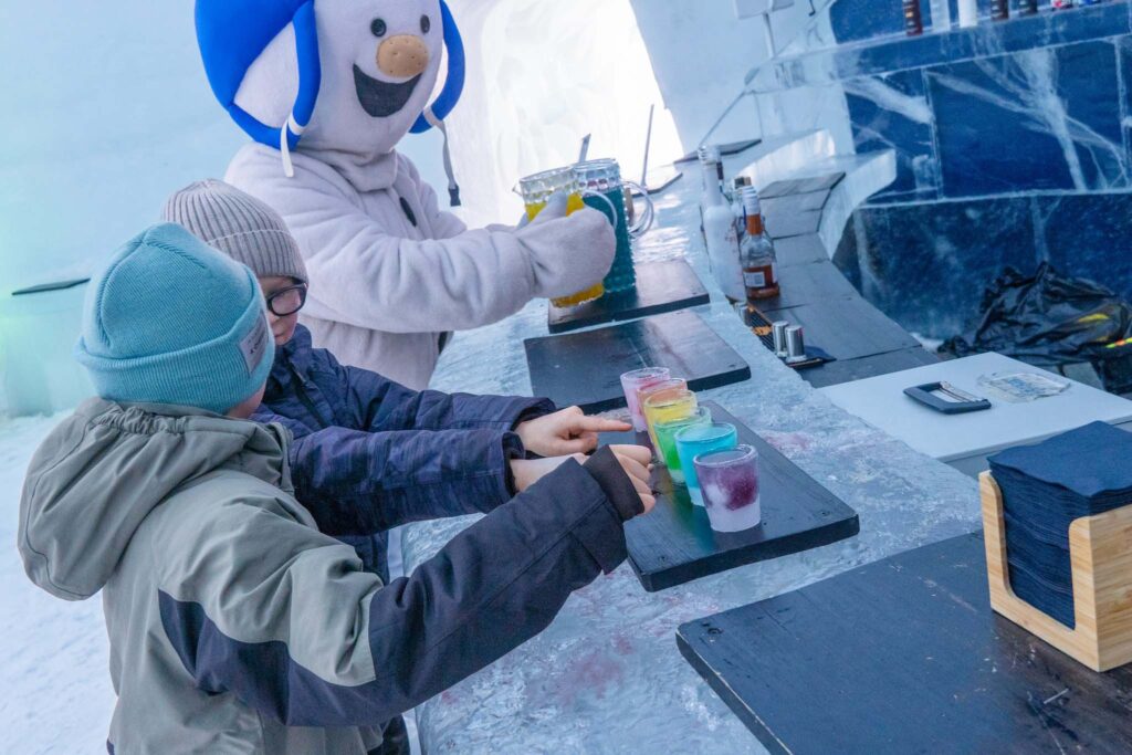 Two children choosing ice drinks in the Ice Bar